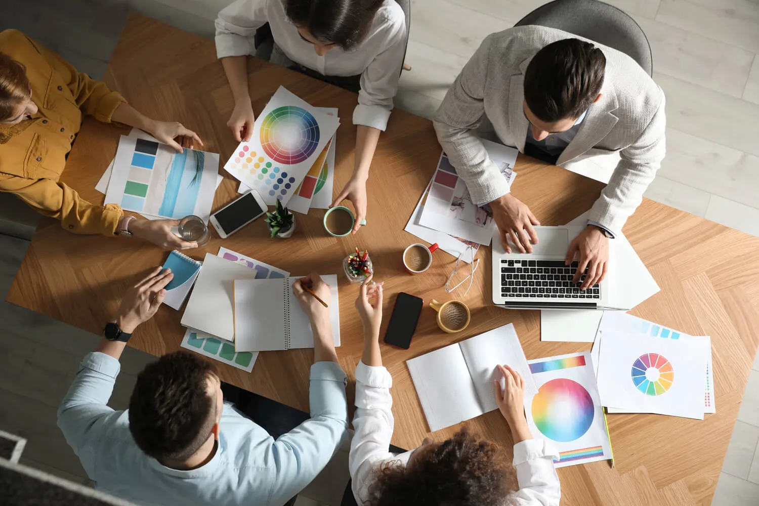 Digital marketing agency team planning brand strategy and creative design elements